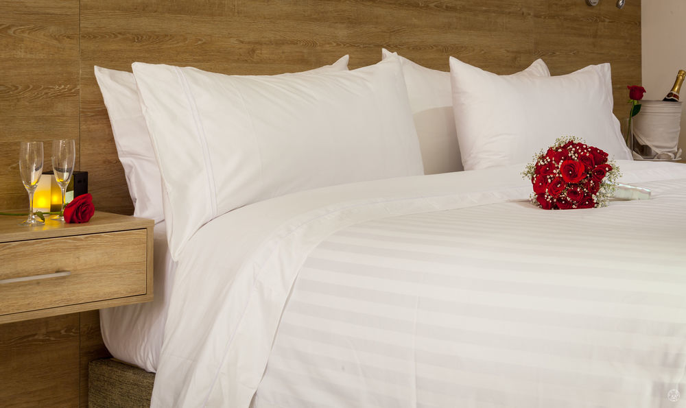 Ghl Collection Barranquilla Hotel Exterior foto A bed with white sheets